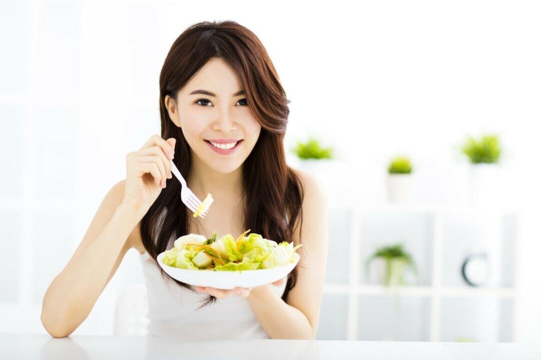 Japanese woman eating salad